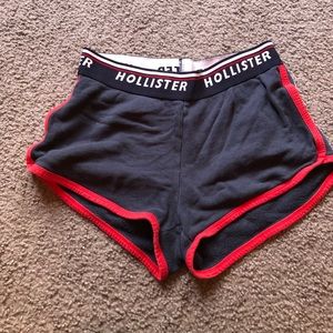 navy hollister shorts with a red & a white stripe